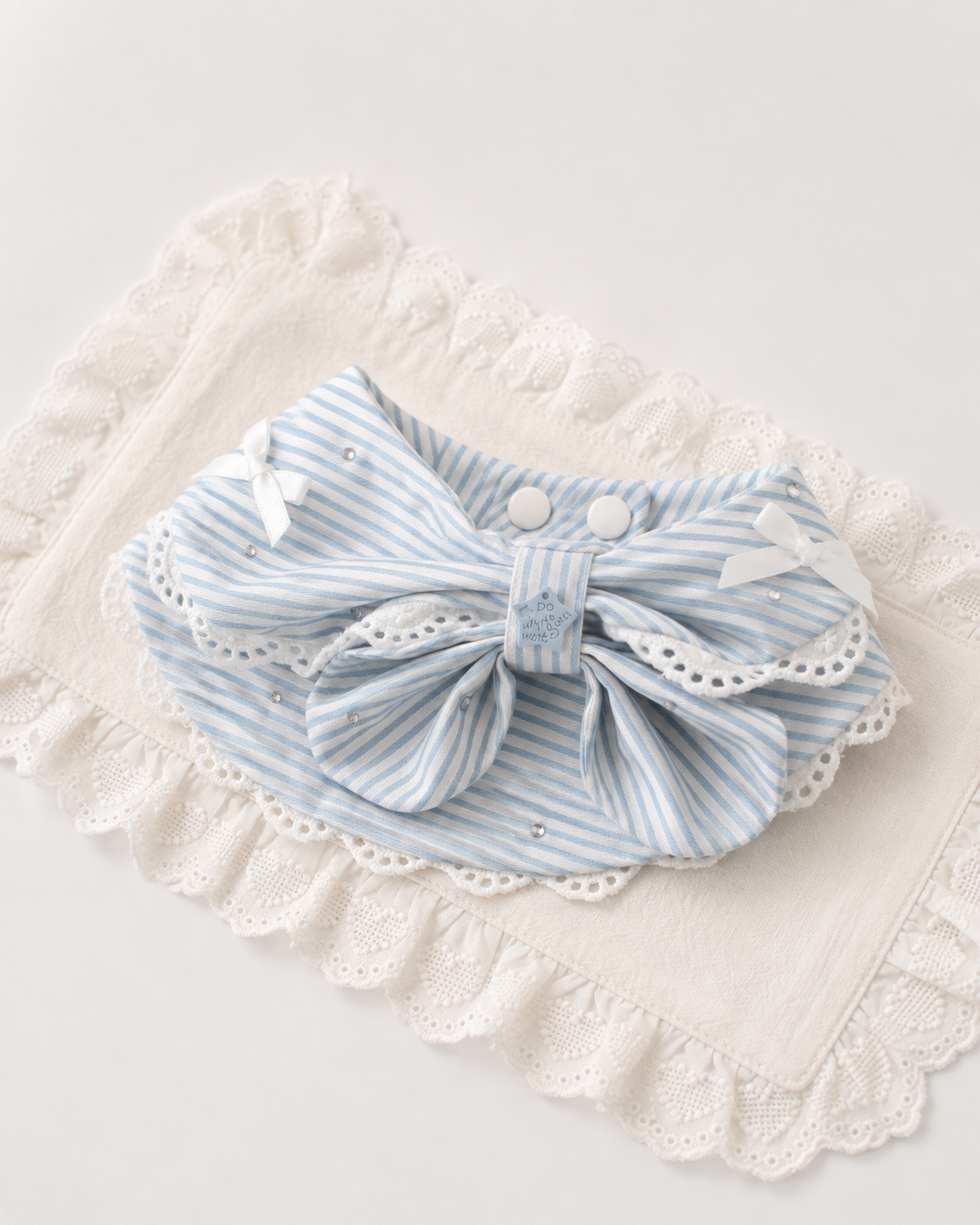 Riviera Stripe Bow Collar flat lay with lace